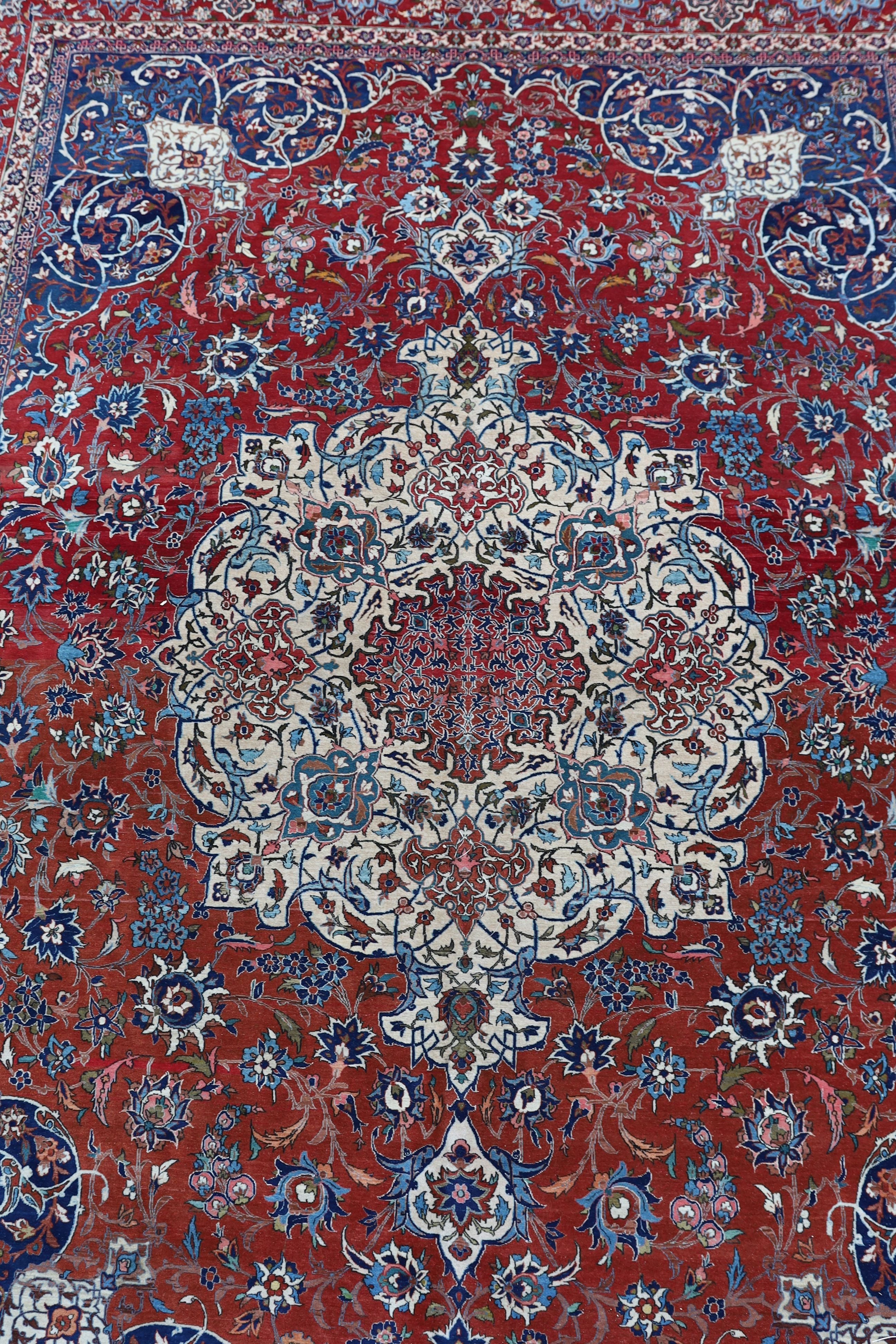 A Isfahan red ground carpet 350 x 260cm.